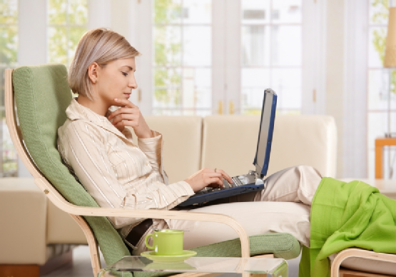 Woman working with computer at home