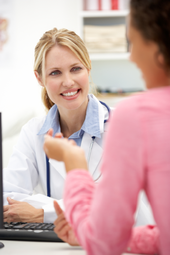 Young doctor with female patient