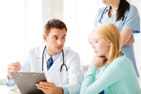 doctor and nurse with patient in hospital