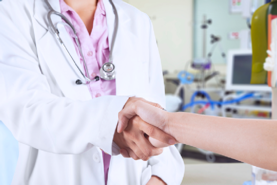 Doctor handshaking with patient